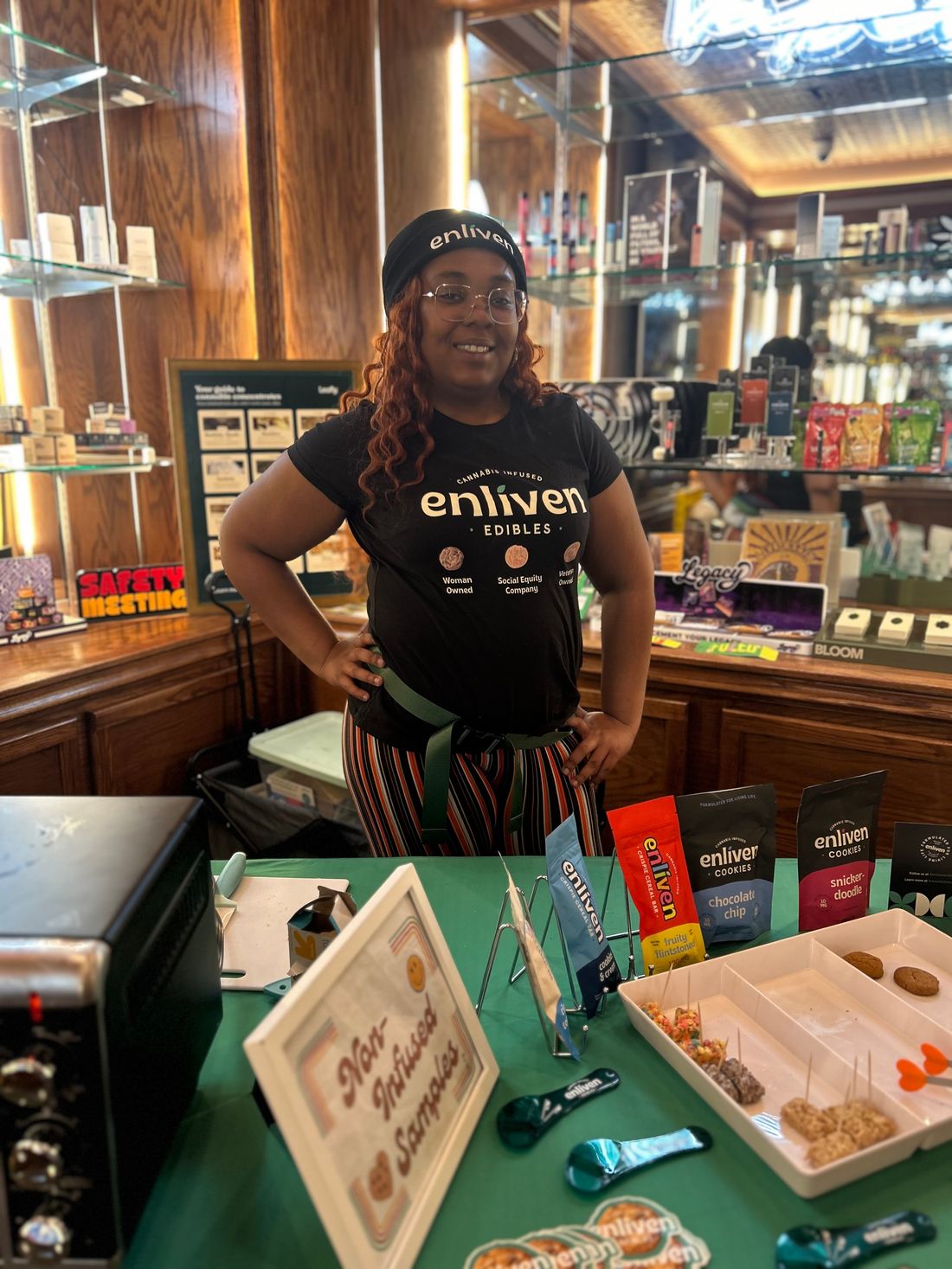 Za Bhang brand ambassador representing Enliven Edibles at a dispensary sampling booth